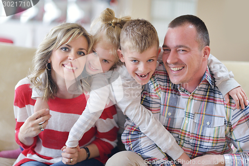 Image of happy young family at home