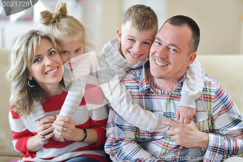 Image of happy young family at home