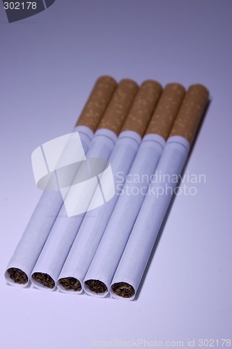 Image of Isolated Cigarettes Under Blue Light