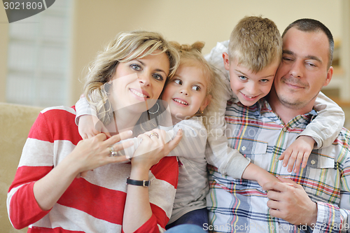 Image of happy young family at home