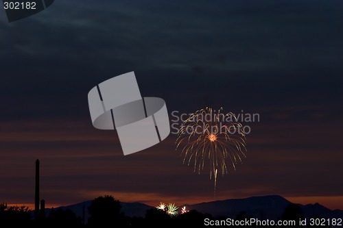 Image of Firecrackers In The Sky During Sunset