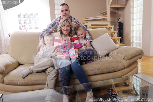 Image of happy young family at home