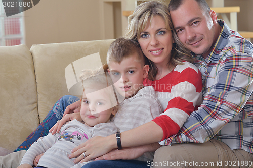 Image of happy young family at home