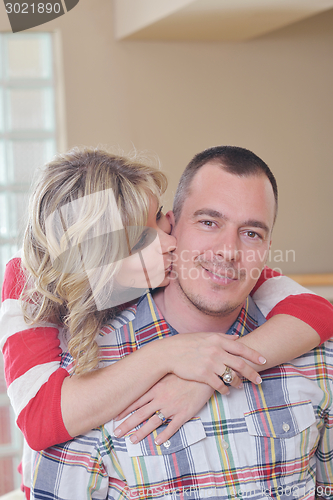 Image of happy couple at home