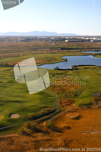 Image of Overlooking at a Golf Course and a Pond