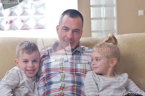 Image of happy young family at home