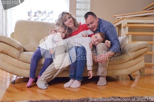 Image of happy young family at home