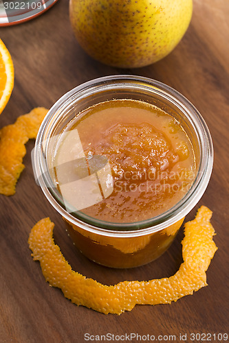 Image of glass of pear jam with orange