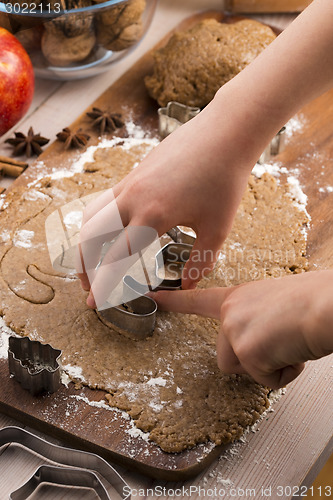 Image of Close up little hands making the gingerbread cookies