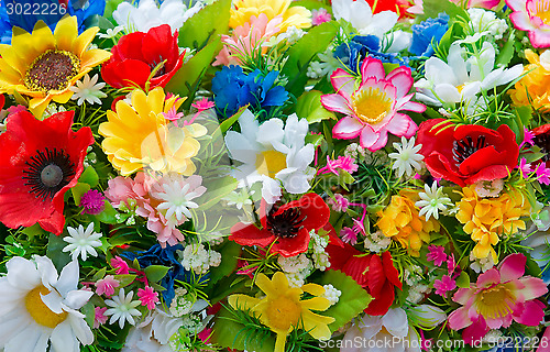 Image of Background of artificial flowers.