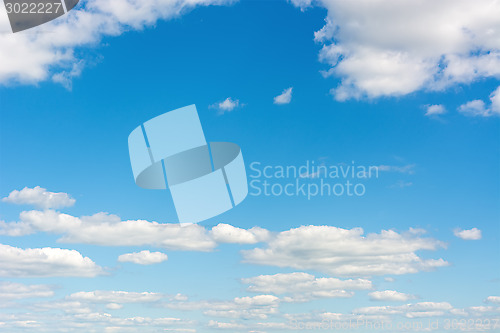 Image of Cumulus clouds in a bright blue sky.