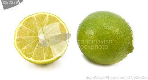 Image of Whole fresh lime and cut half fruit