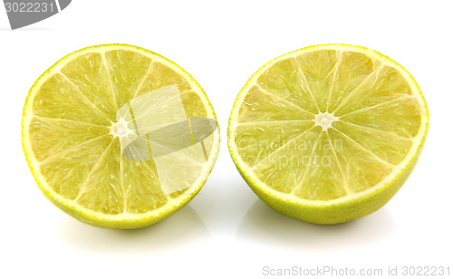 Image of Fresh lime fruit cut in half showing cross section