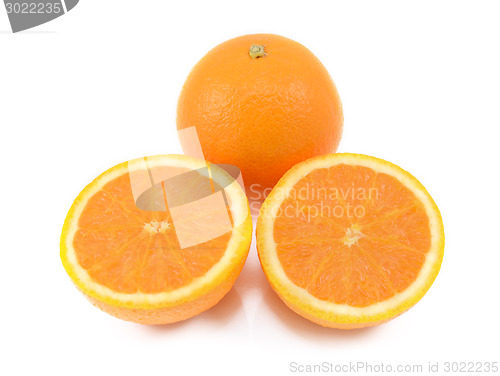 Image of Whole orange and two juicy cut halves