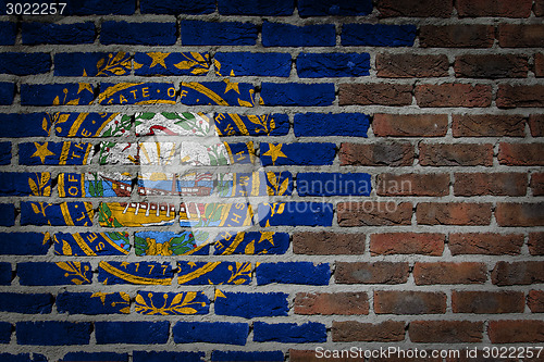 Image of Brick wall texture with flag