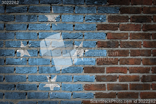 Image of Brick wall texture with flag