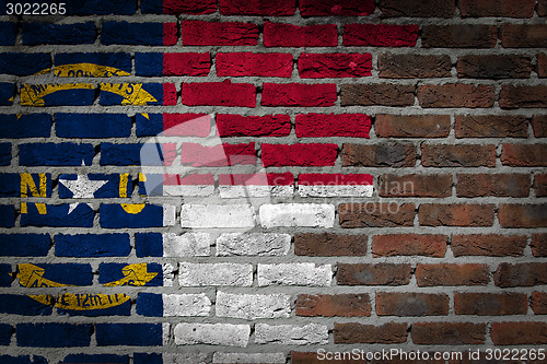 Image of Brick wall texture with flag