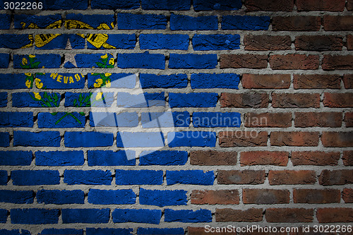 Image of Brick wall texture with flag