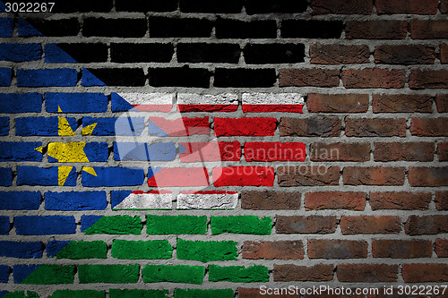 Image of Brick wall texture with flag