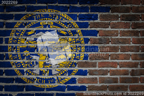 Image of Brick wall texture with flag