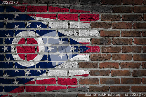 Image of Brick wall texture with flag