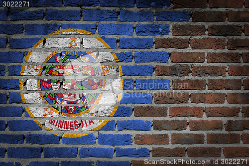 Image of Brick wall texture with flag