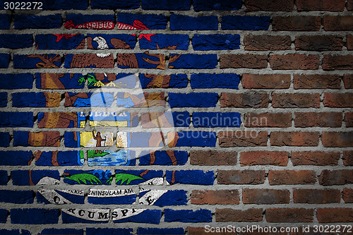 Image of Brick wall texture with flag