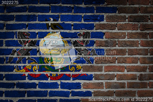 Image of Brick wall texture with flag