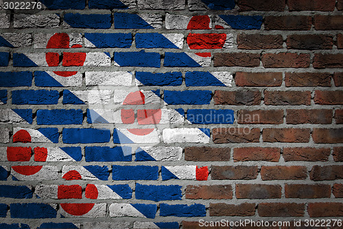 Image of Brick wall texture with flag