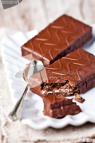 Image of dark chocolate cakes and spoon