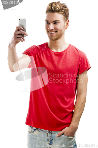 Image of Young man taking a selfie