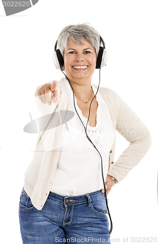 Image of Elderly woman listen music