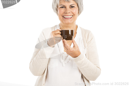 Image of Elderly woman drinking coffee