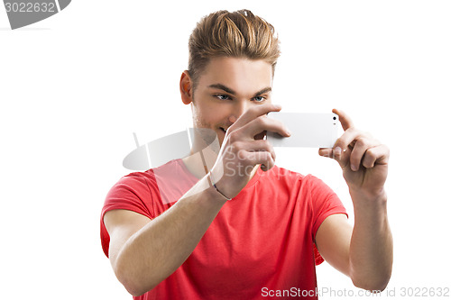 Image of Young man taking a selfie