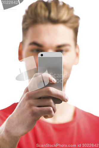 Image of Young man taking a selfie