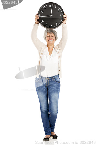 Image of Elderly woman holding a clock