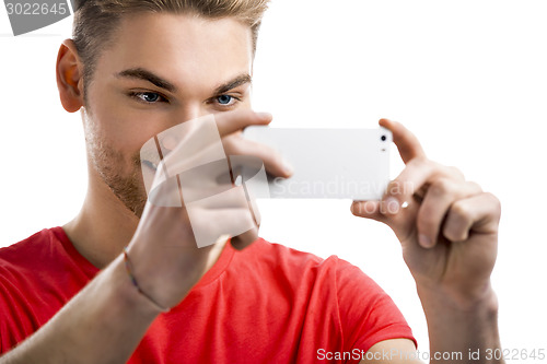 Image of Young man taking a selfie