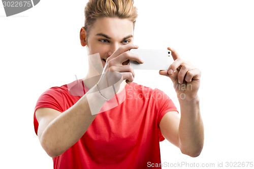 Image of Young man taking a selfie