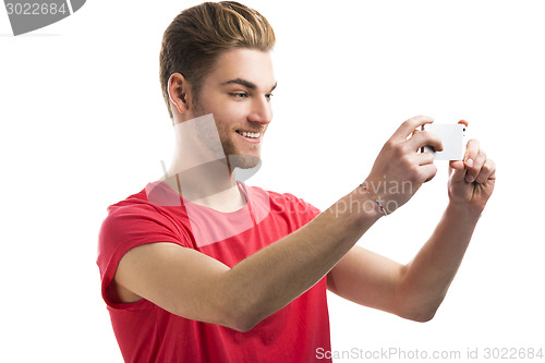 Image of Young man taking a selfie