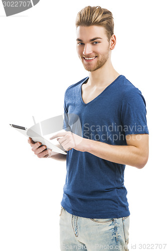 Image of Young man working with a tablet