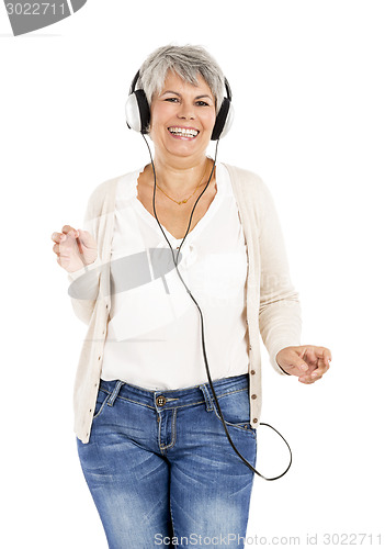 Image of Elderly woman listen music