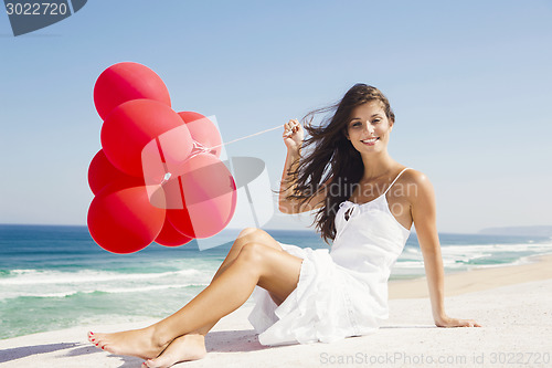 Image of Girl with red balloons