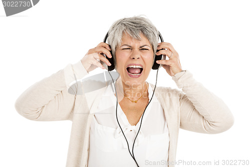 Image of Elderly woman listen music