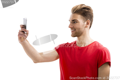 Image of Young man taking a selfie
