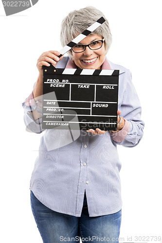 Image of Elderly woman holding a clapboard