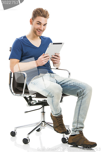 Image of Young man working with a tablet