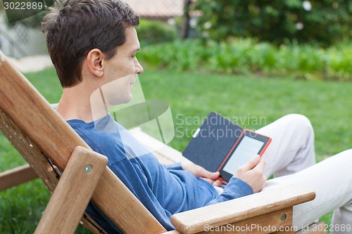 Image of relaxing man reading