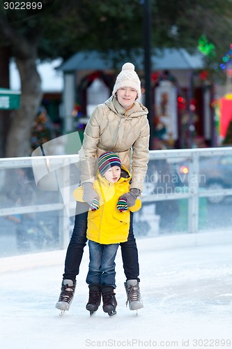 Image of family ice skating