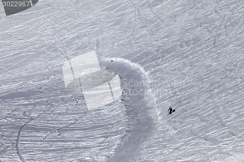 Image of Skier on off-piste slope in sun day