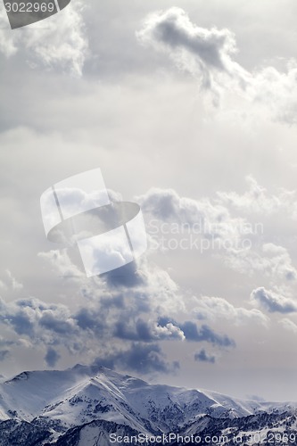 Image of Mountains in evening and sunlight cloudy sky